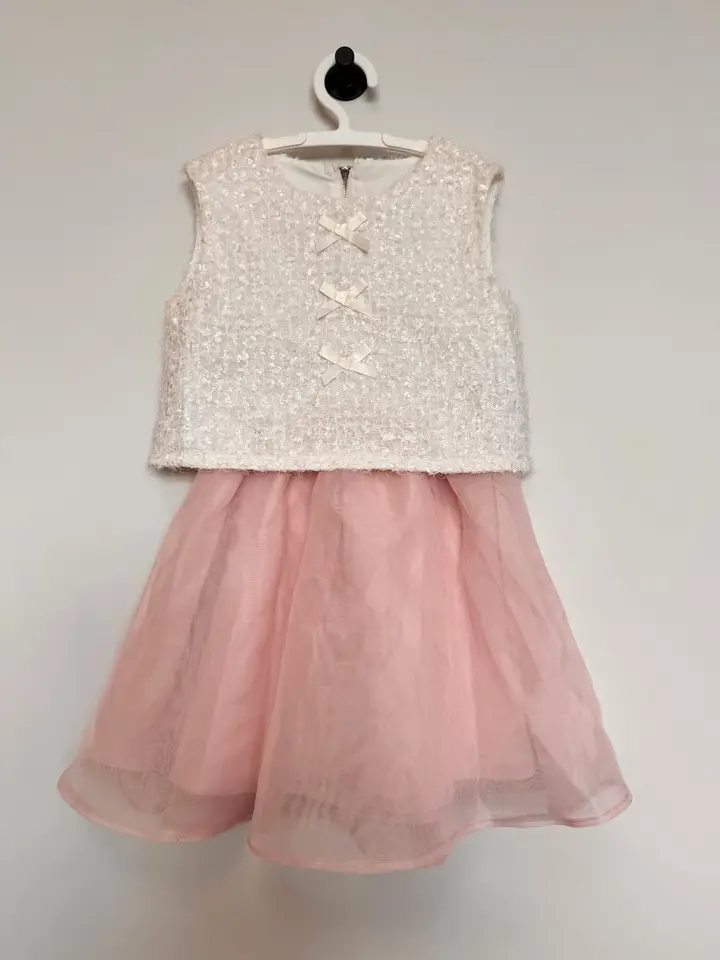 Children’s dress with an ivory sequin bodice and pink tulle skirt