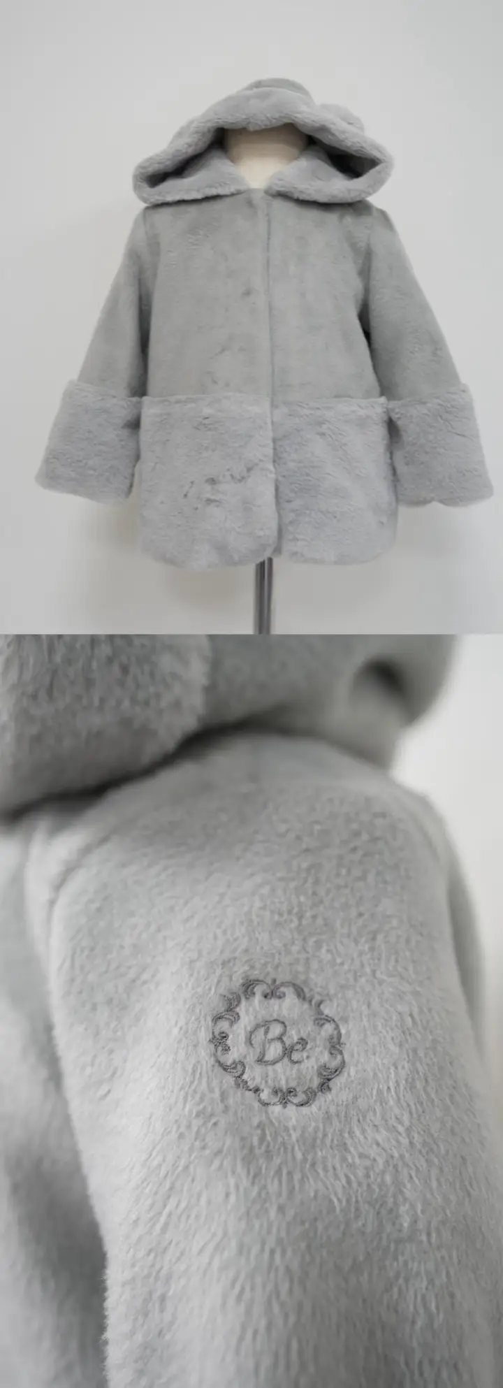 Gray plush hooded children’s coat with an embroidered sleeve detail